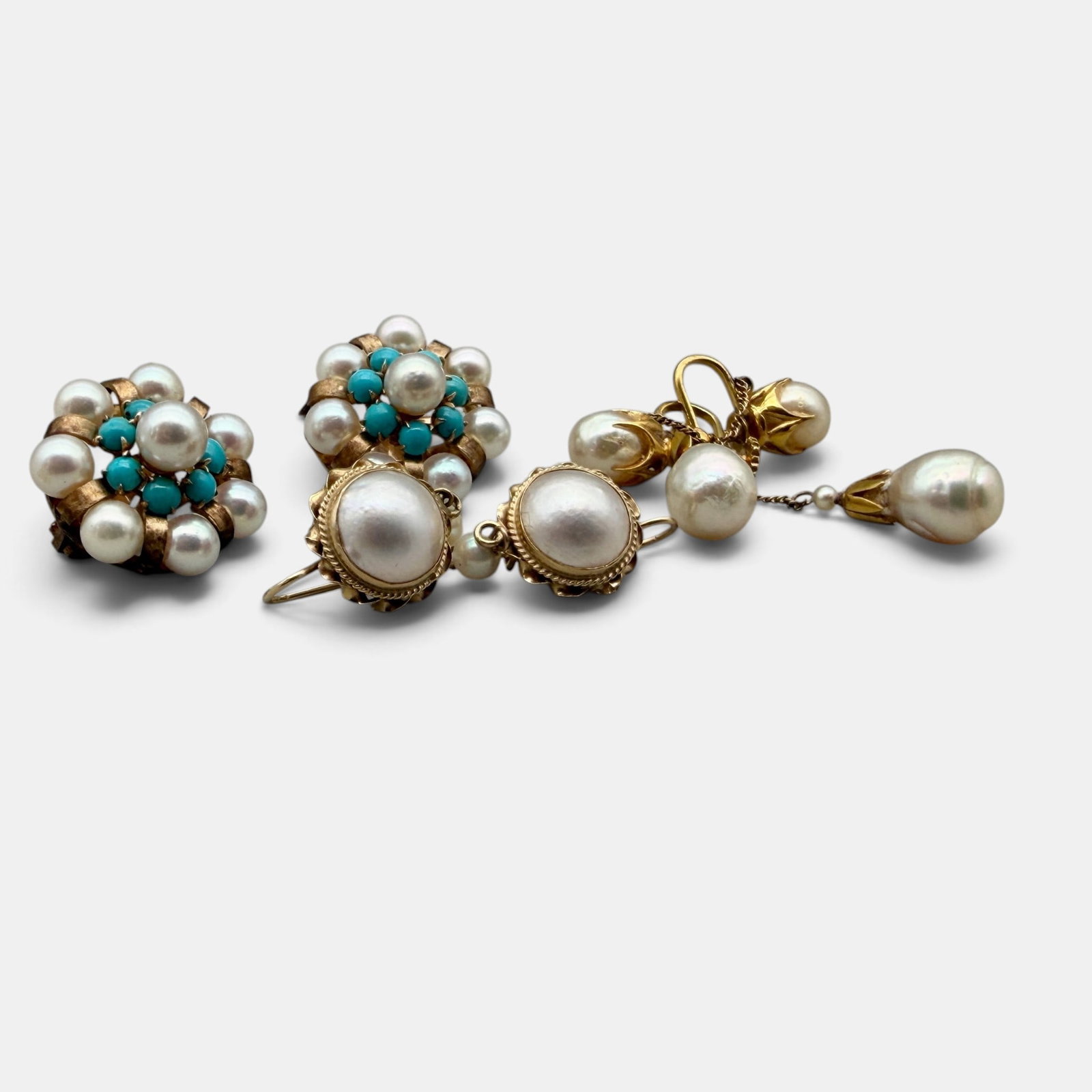 Group of 14k Pearl Jewelry: Including two clip earrings with pearls and turquoise, marked for 14k gold. One pair of pearl earrings marked for 14k gold and one additional pair of pearl dangle earrings, unmarked. Total weight: