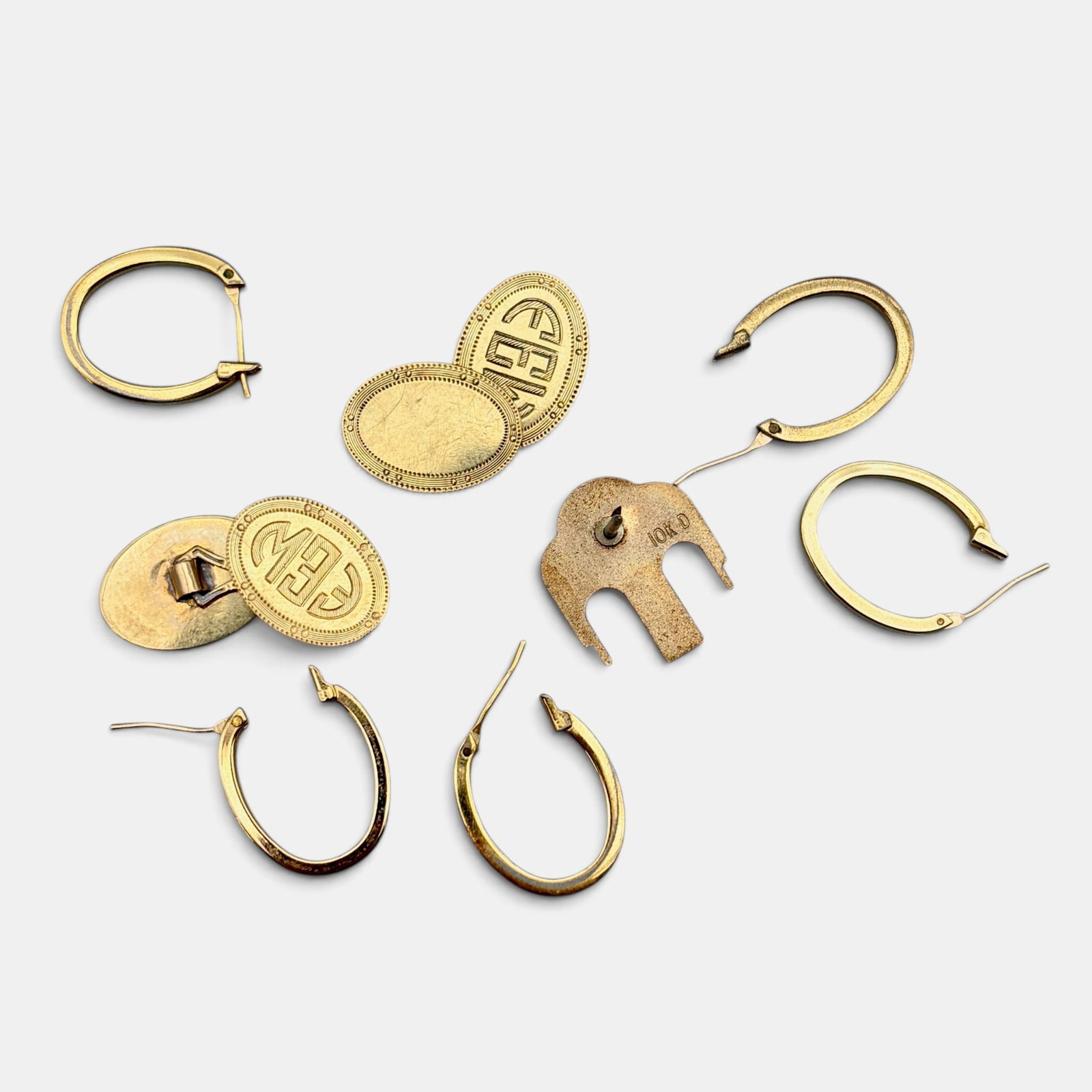 Group of 10k Earrings, Cufflinks, and a Pin: Total weight .42 ozt.