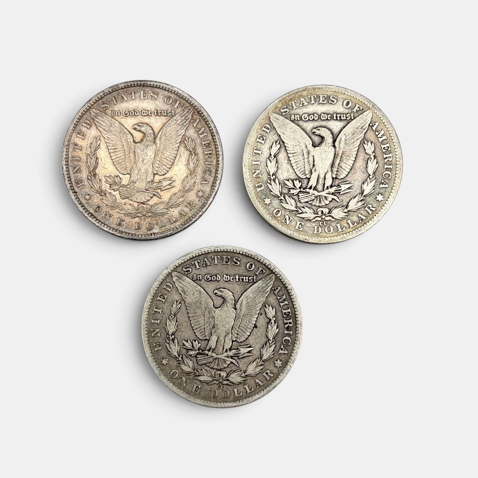 Pair of Carson City Morgan Dollars, 1879 and 1890: Both in circulated condition, ungraded.