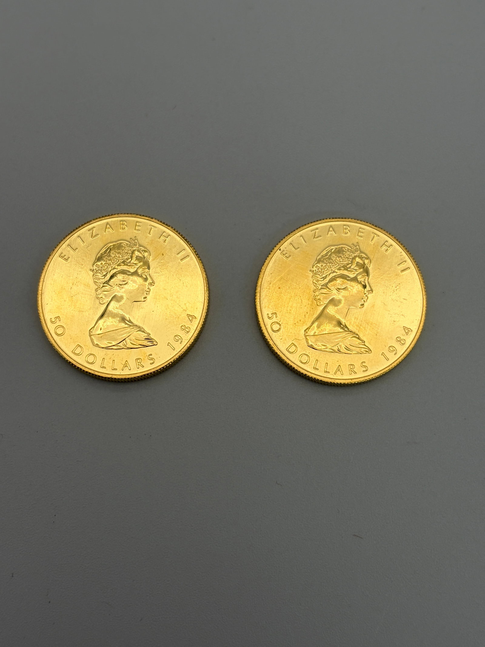Pair of American Liberty One Ounce Fine Gold Pieces: 1992 and 1993, a pair of one ounce liberty American eagles.