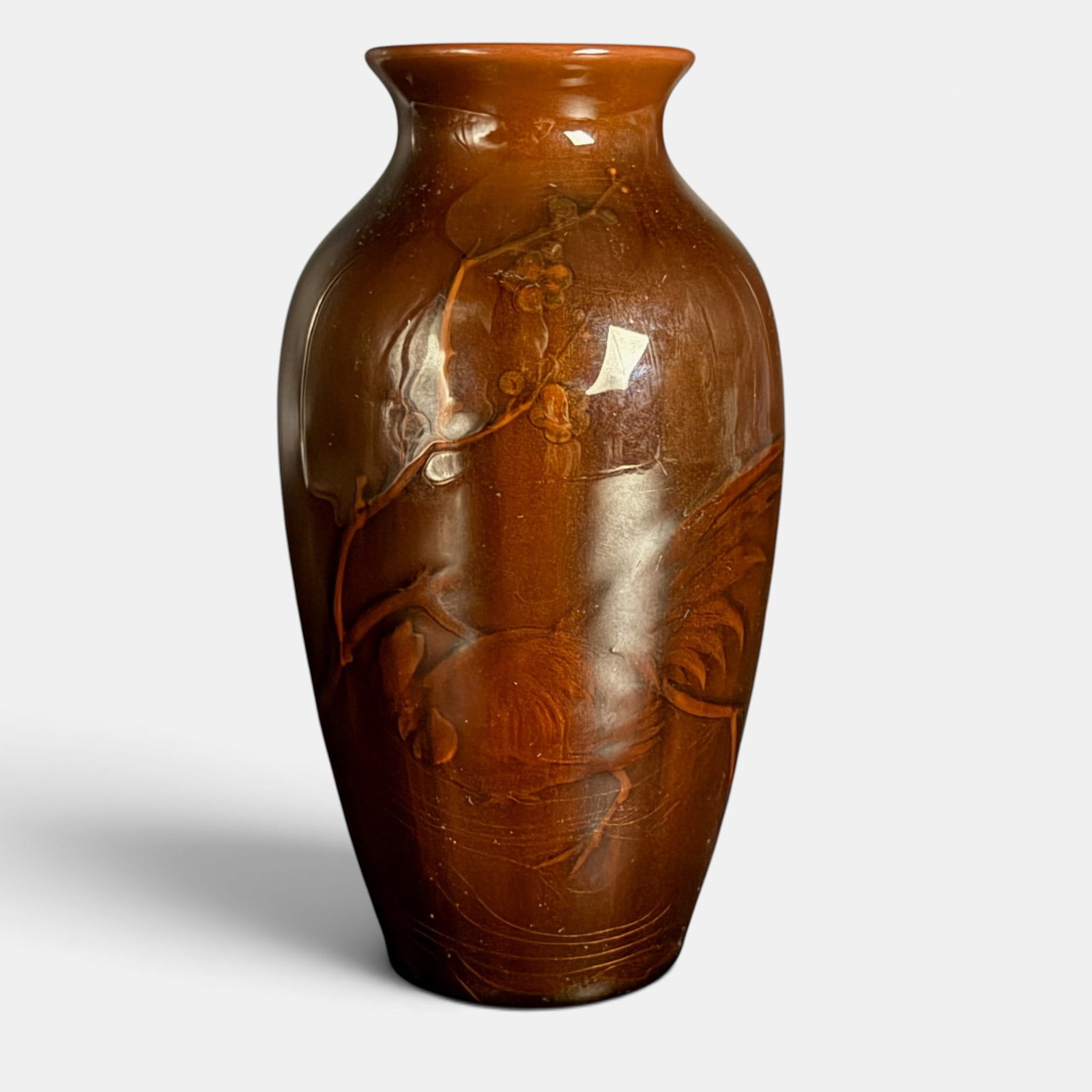 Rookwood Tiger Eye vase, Rooster, Albert Valentien, circa 1886.: Rookwood Tiger Eye vase featuring a strutting rooster beside a flowering tree, the work of Albert Valentien, circa 1886. Tiger Eye effect has obscurred all marks on the bottom save Valentien's initial