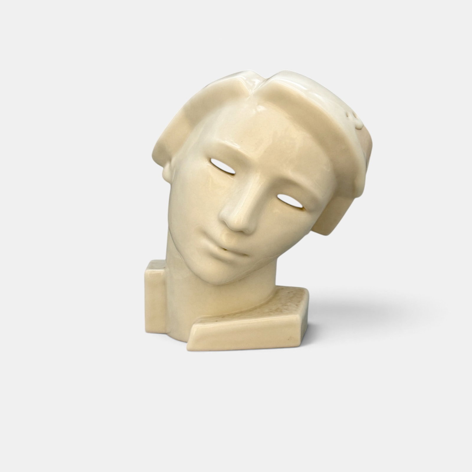 Rookwood Mask, Abel design, 1934.: Rookwood Art Deco mask, a Louise Abel design done in white glossy glaze in 1934. Impressed Rookwood logo, XXXIV, Shape number 6244, A in circle and two wheel ground Xes. Height 9 1/8 inches.