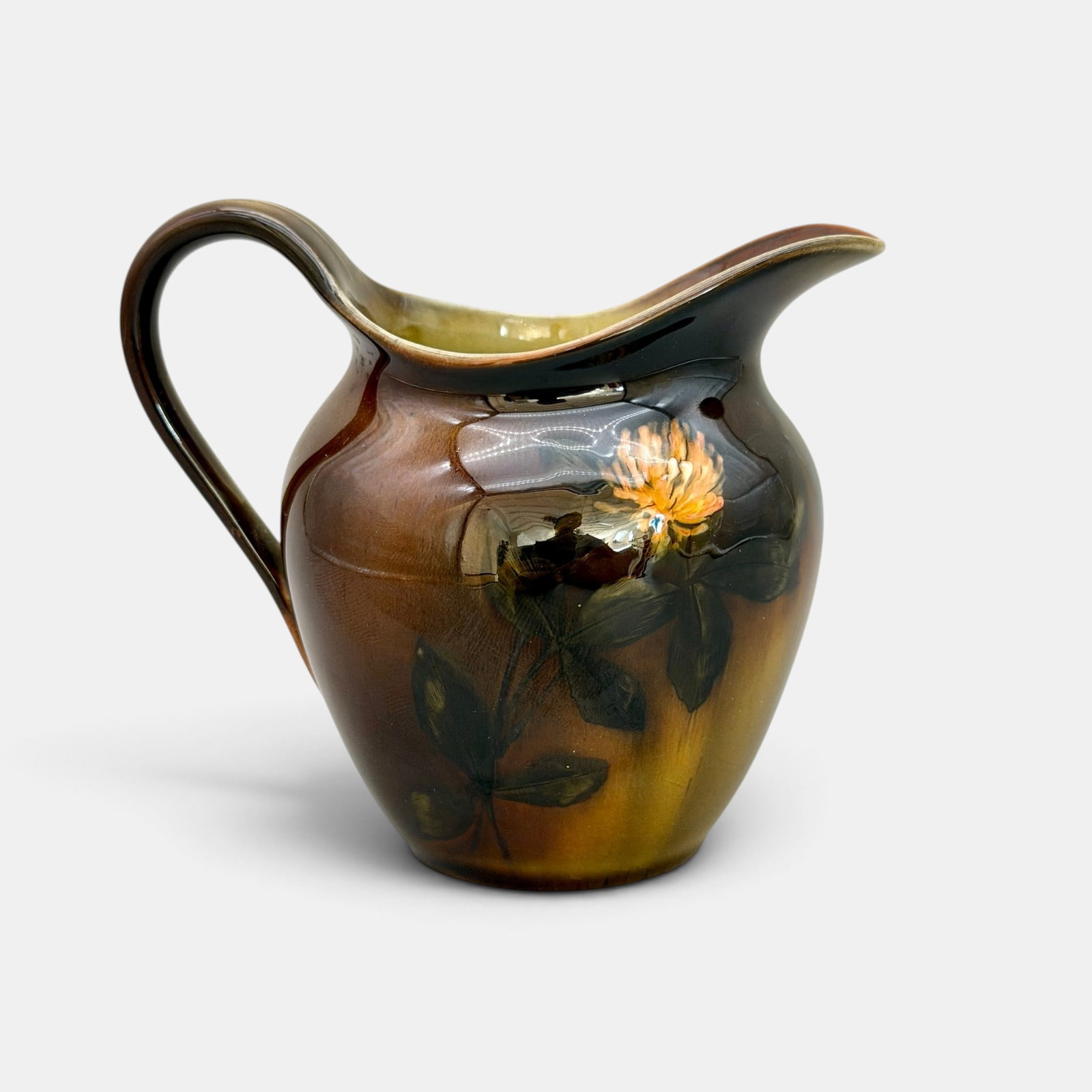 Rookwood Standard glaze pitcher, clover, Anna Valentien, 1889.: Rookwood Standard glaze pitcher with red clover decoration done by Anna Valentien in 1889. Impressed Rookwood logo with three flames, Shape number 523, S for sage green clay. Incised AMV/L for artist 