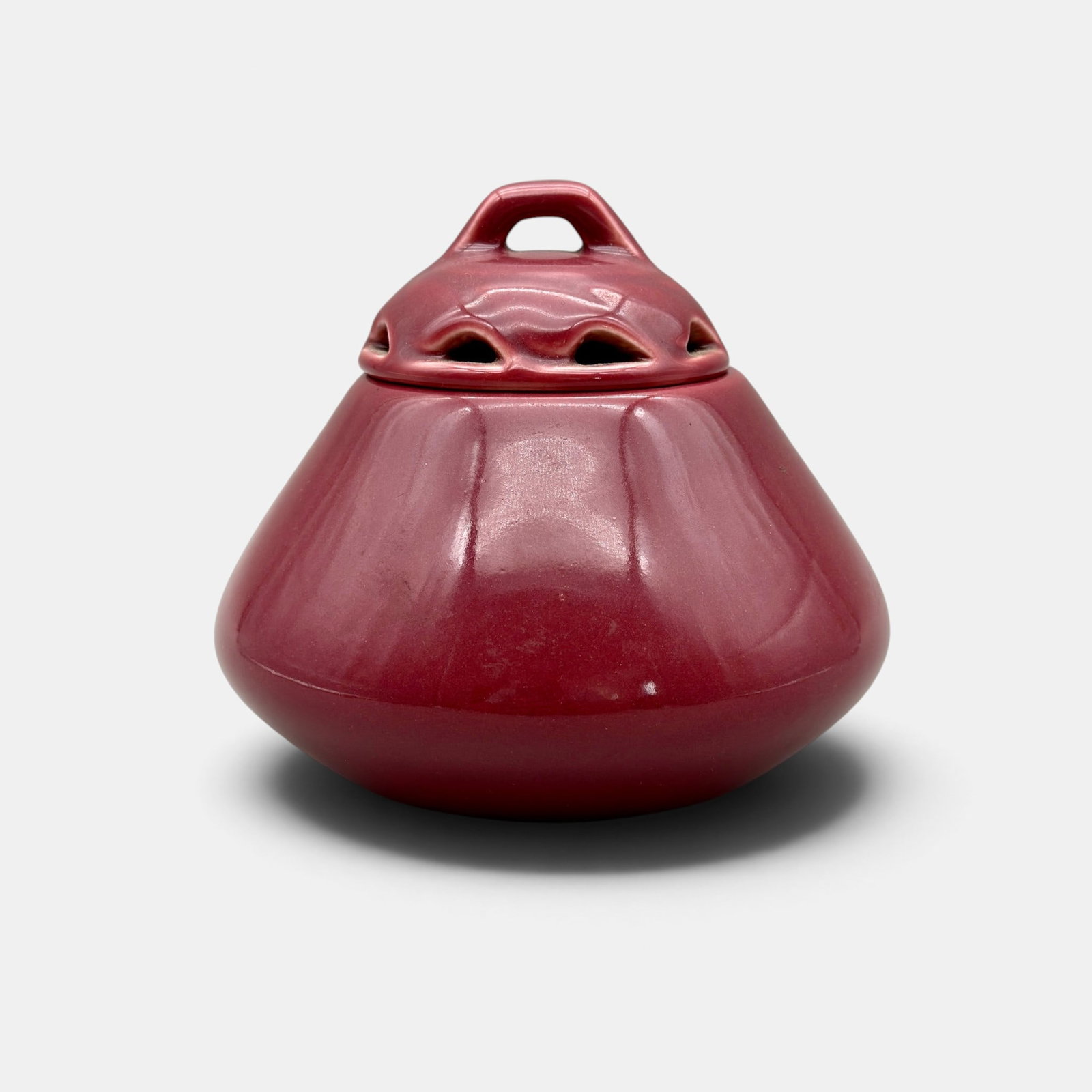 Rookwood scent jar, two lids, 1922.: Rookwood Porcelain scent jar with both inner and outer lid, done in a rich maroon glaze in 1922. Impressed Rookwood logo, XXII, Shape number 2337. Height 4 3/8 inches.