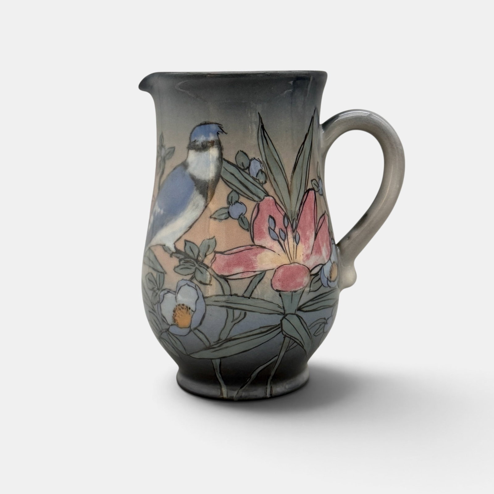 Rookwood pitcher, blue jays, Hurley, 1949.: Nicely painted Rookwood Porcelain pitcher with exotic flowers and two bluejays done by E.T. Hurley in 1949. Impressed Rookwood logo, XLIX, Shape number 6757. Incised ETH. Height 7 1/4 inches.