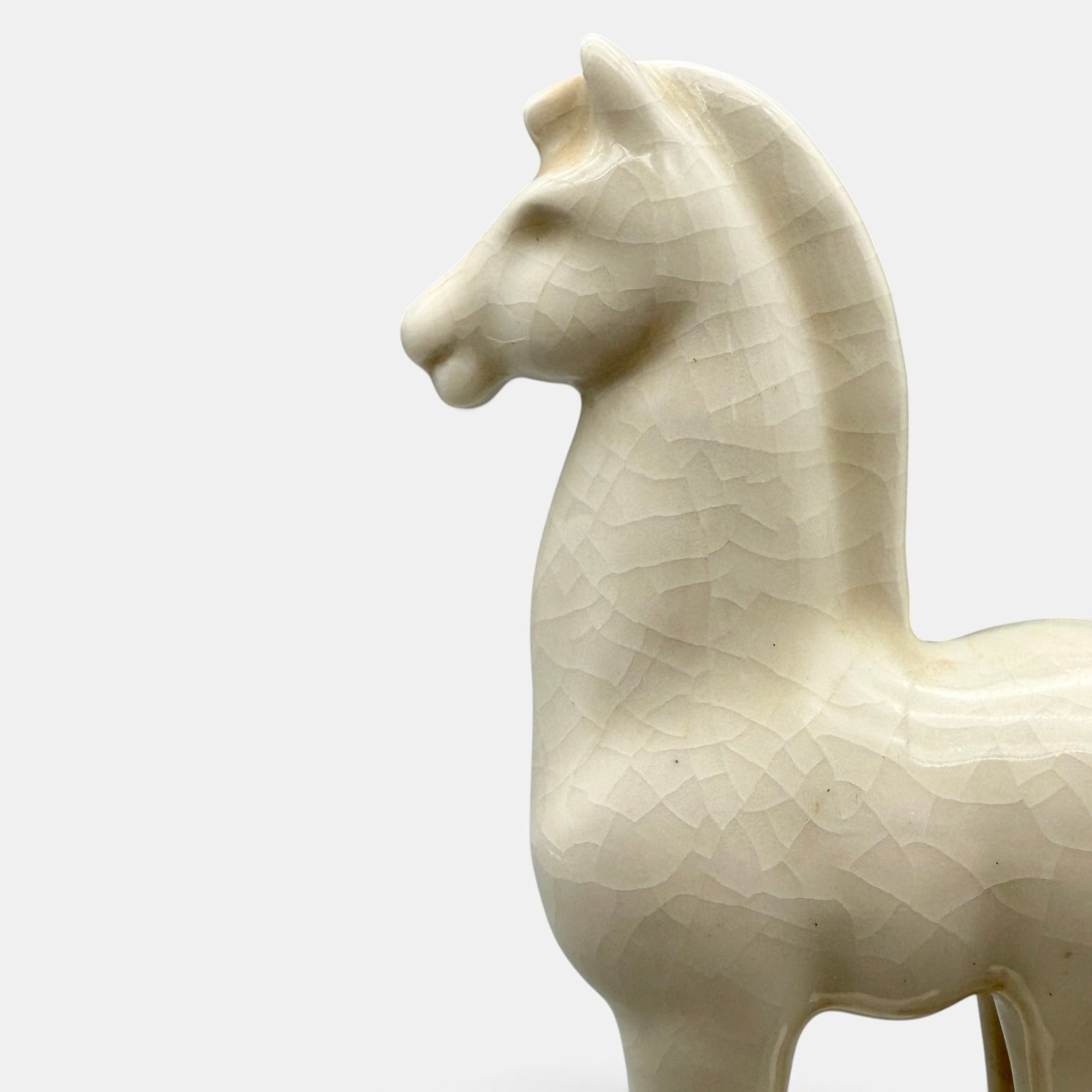 Rookwood Carousel Horse paperweight, 1946.: Rookwood Carousel Horse paperweight, a Wilhelmine Rehm design, done in glossy white glaze in 1946. Impressed Rookwood logo, XLVI, shape number 6929, WR. Height 8 3/8 inches.