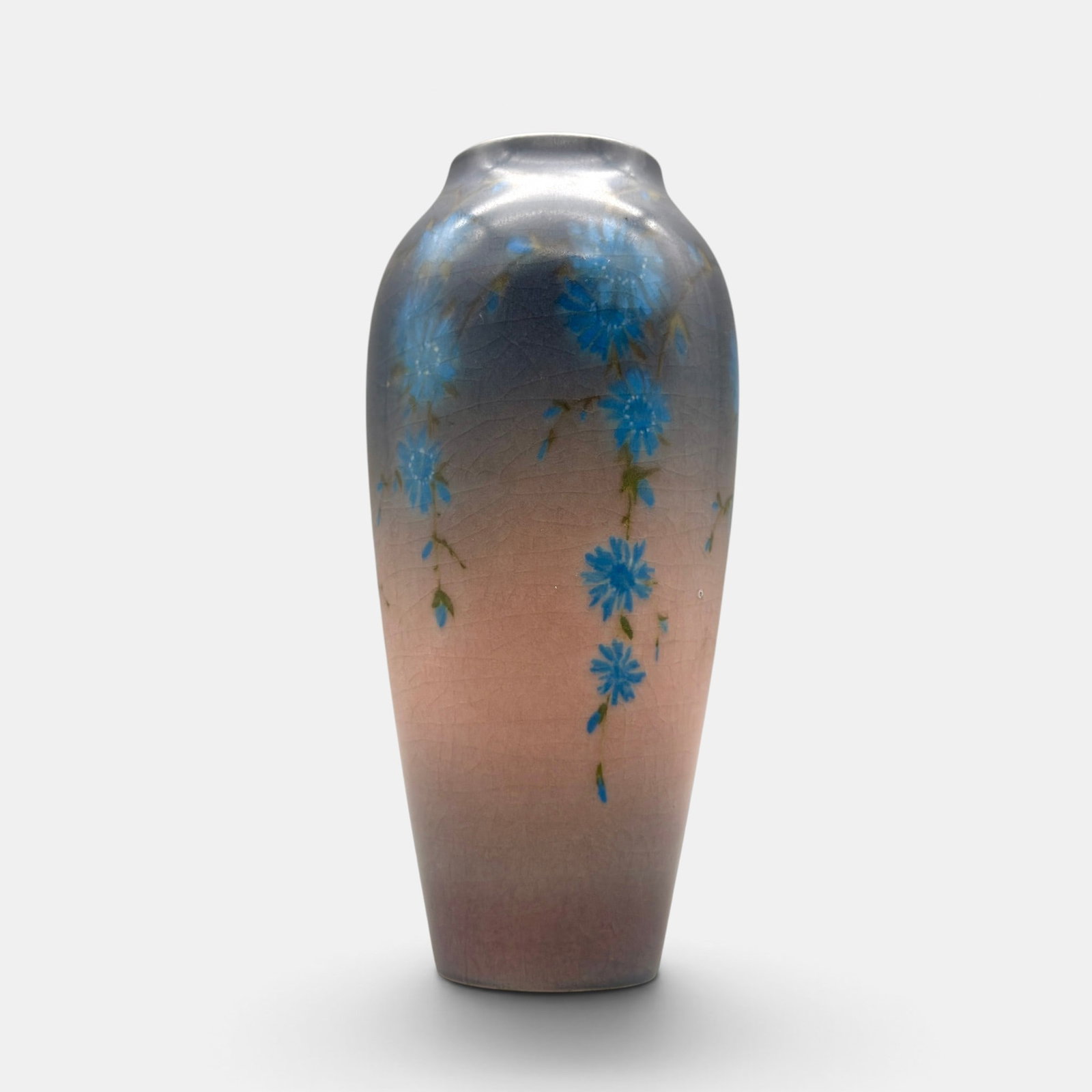 Rookwood Vellum floral, Wilcox, 1921.: Rookwood Vellum glaze vase, trailing blue flowers painted by Harriet Wilcox in 1921. Impressed Rookwood logo, XXI, Shape number 295 E, V. Incised H.E.W. Height 7 1/2 inches.