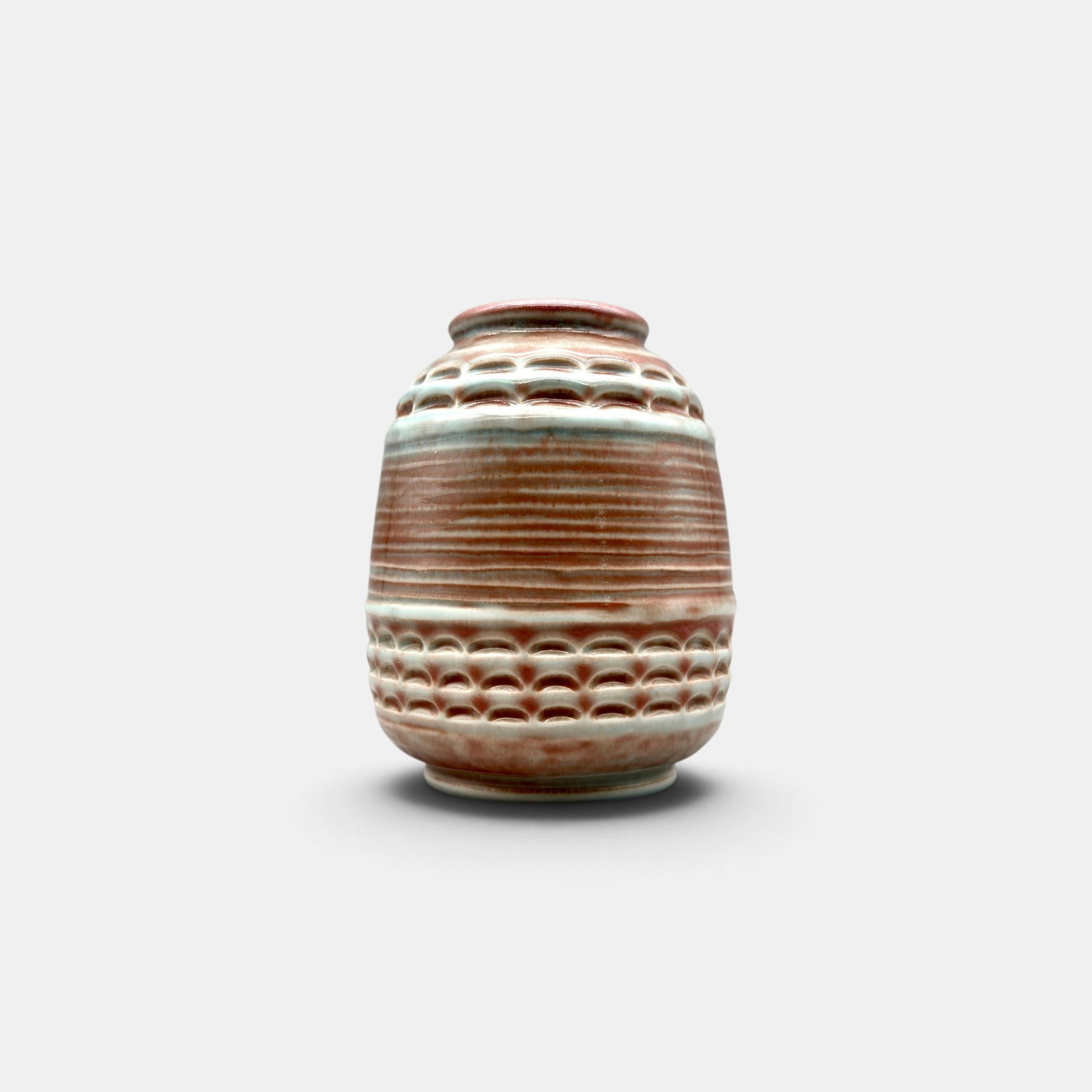 Unusual Rookwood production vase, 1931.: Rookwood production vase, a Wilhelmine Rehm design, that appears to be hand carved but is not. Done in a soft rose glaze over the clay body, the vase has the impressed Rookwood logo XXXI, Shape