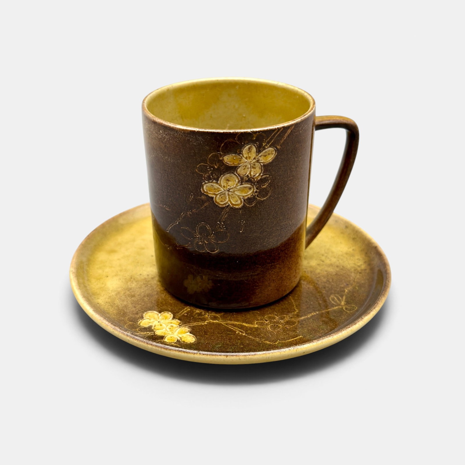 Rookwood Standard cup and saucer, Anna Valentien, 1883 and 1886.: Assembled Rookwood Standard glaze chp and saucer with both painted and incised small yellow flowers done by Anna (Bookprinter) Valentien in 1886. Impressed ROOKWOOD,1883 and 1886, Shape nukber 208, S