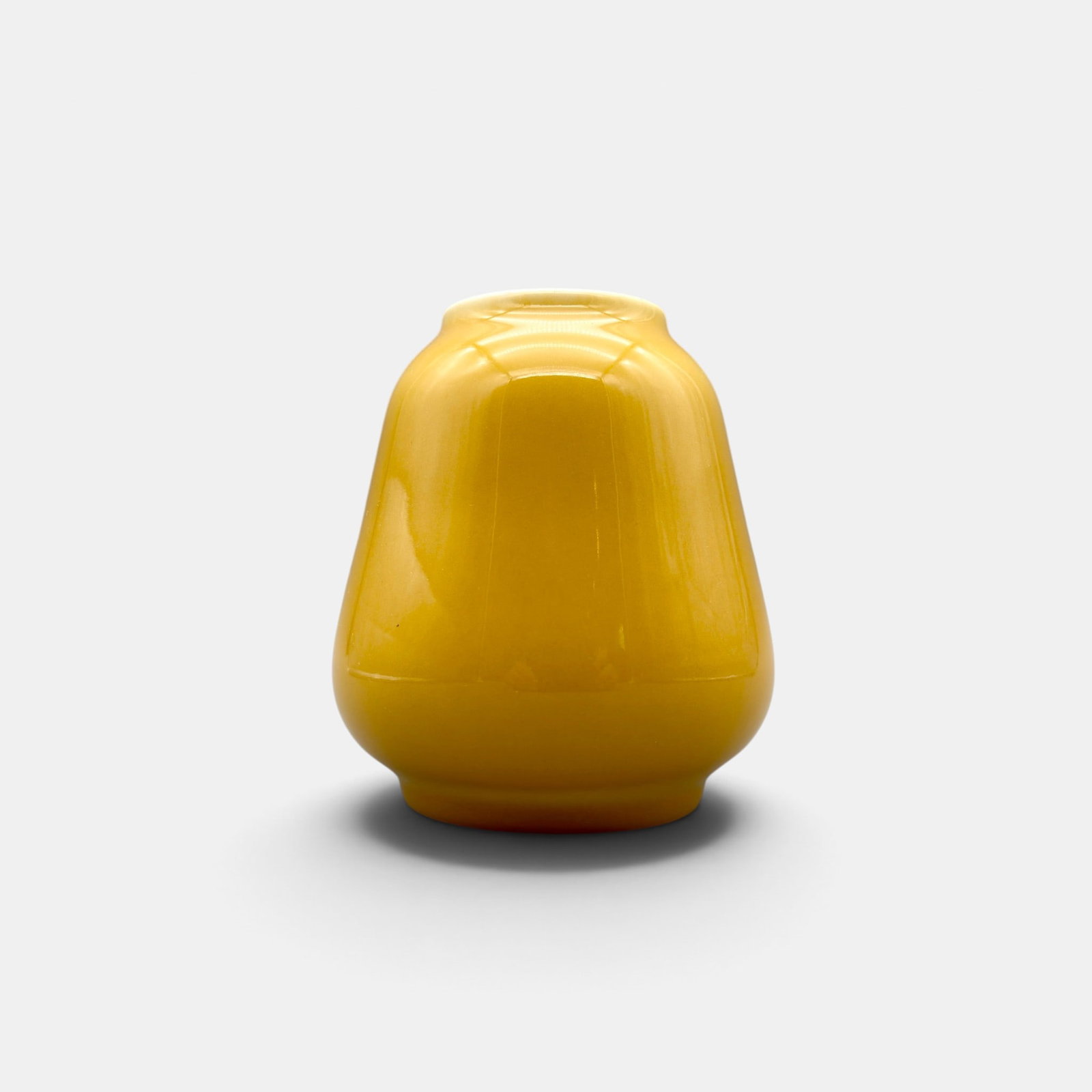 Earl Menzel porcelain vase, Rookwood 1936.: Hand thrown porcelain vase in yellow done in 1936 by Earl Menzel. Impressed Rookwood logo, XXXVI, S for Special shape and Menzel swirl. Height 5 inches.