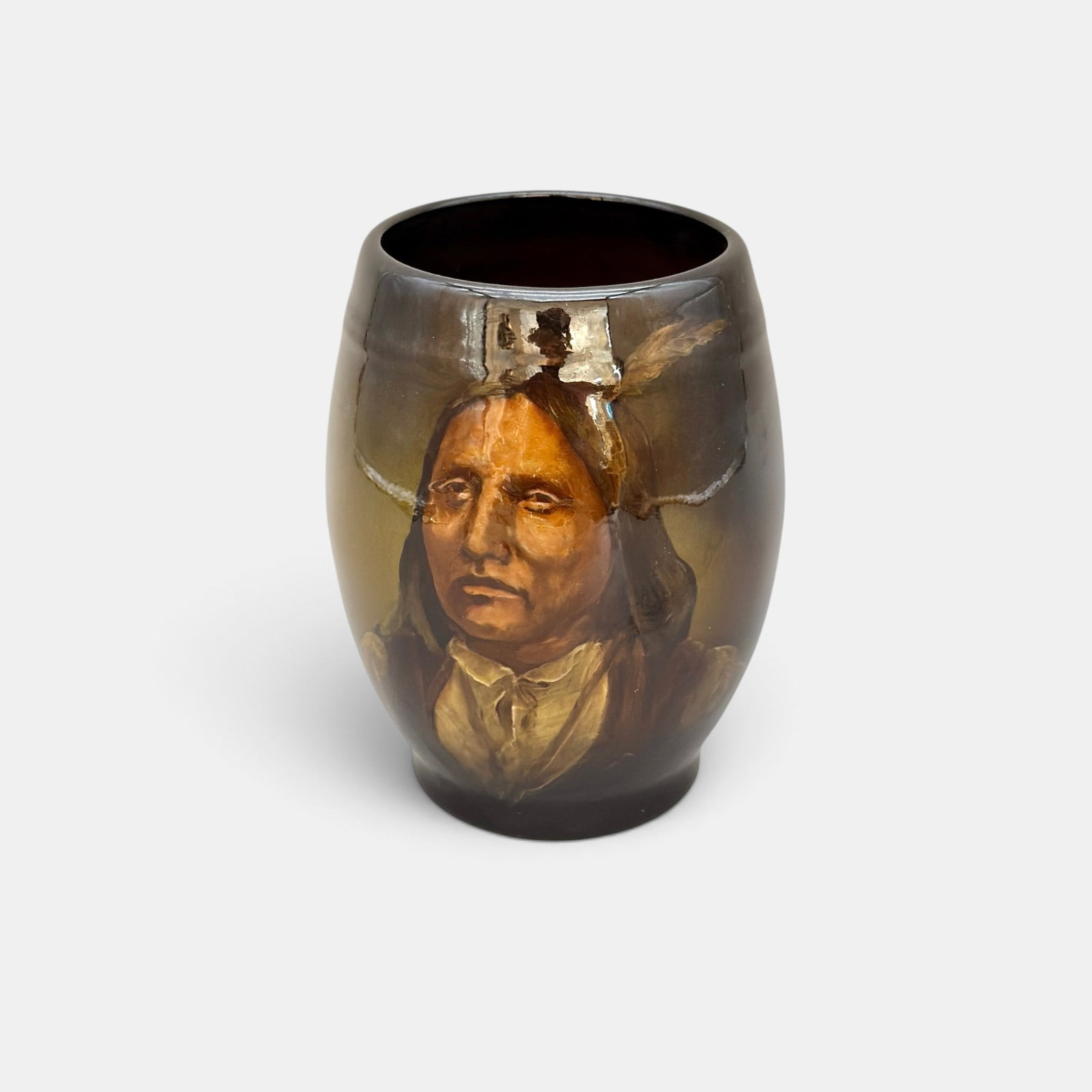 Native American portrait on Rookwood mug, Hurley, 1897.: Uncommon Native American portrait done by Rookwood artist, E.T. Hurley in 1897. More comfortable with animals, Hurley did few images of people and in this example, the work is quite well done.