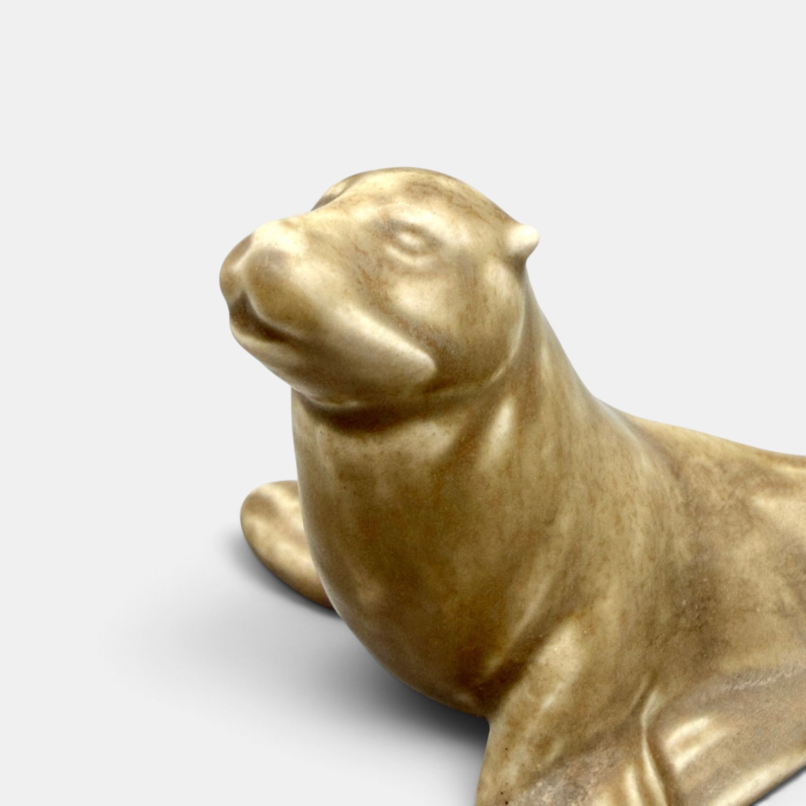 Rare Rookwood Seal paperweight in brown mat, 1929.: Rare Rookwood Seal paperweight in tan mat glaze, a Shirayamadani design from 1929. Impressed Rookwood, XXIX, Shape number 6071. Height 3 inches.