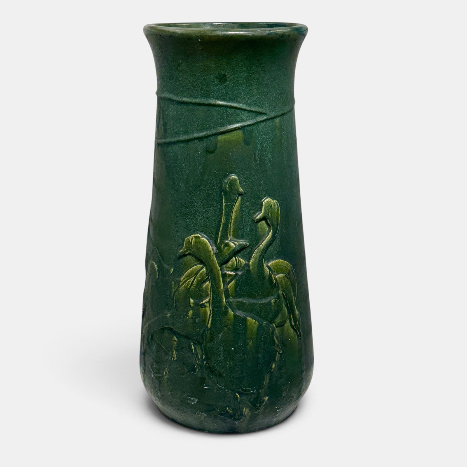 Rookwood umbrella stand, geese, circa 1905.: Uncommon but well used Rookwood umbrella stand in a green mat glaze with embossed flock of geese, made, circa 1905. Impressed marks include four Rookwood logos and the Architectural Department