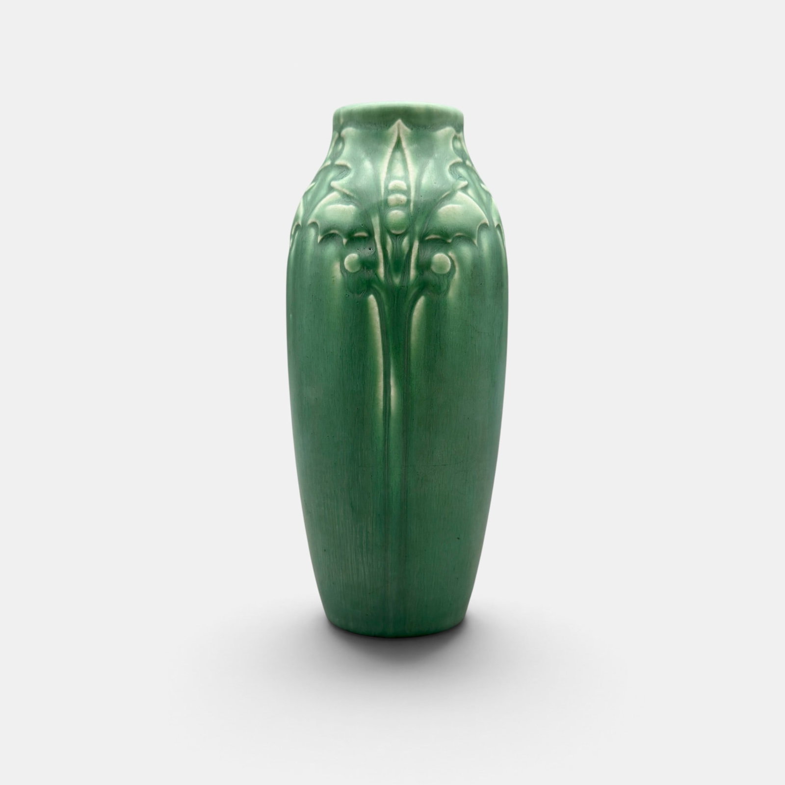 Rookwood production vase, circa 1920.: Crisp Rookwood production vase with holly-like flowers, done circa 1920. Impressed Rookwood logo. Date and shape number are obscured by extra glaze but date is circa 1925. Height 6 5/8 inches.