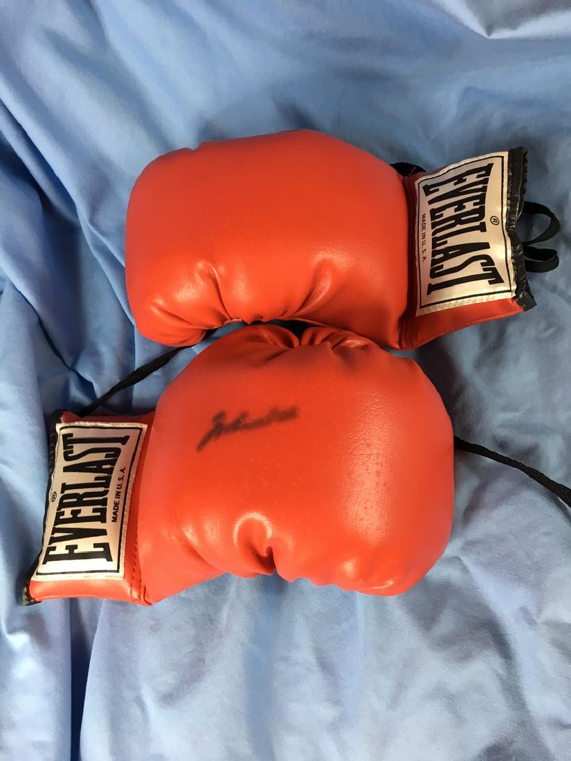 Muhammad Ali signed boxing gloves: Gloves in good shape , signature is smudge , 11.5" x7"