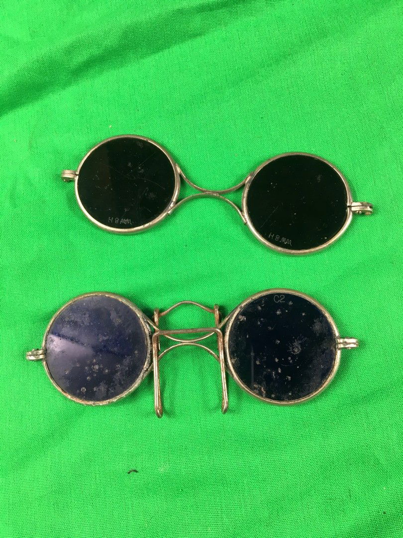 Blue tinted antique welding glasses Steampunk glasses: Blue tinted welding glasses , A similar pair was worn in the movie national treasure , They are missing the sides that go over the ear.