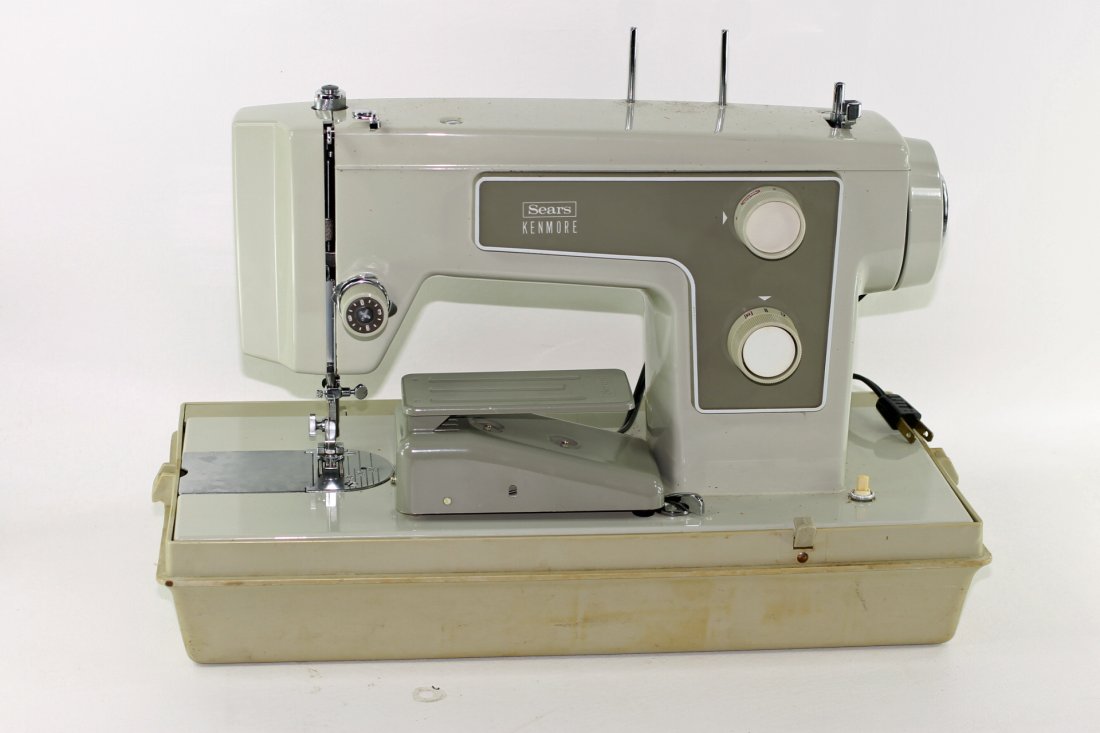 Sears Sewing Machine: Sears sewing machine. Older type made mostly of metal. Has a plastic case.