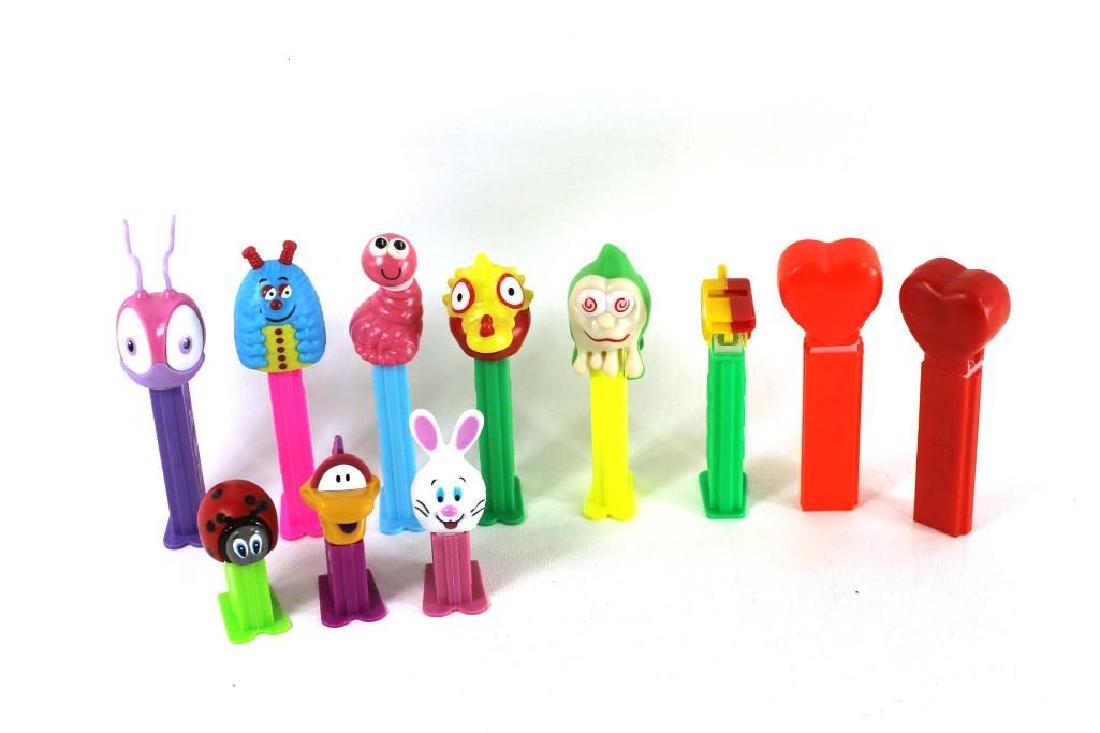 Lot of 11 Pez Dispensers: Lot of 11 Pez dispensers including some mini dispensers. Spring themed