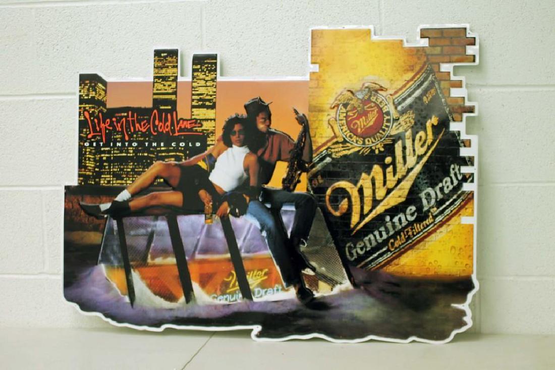 Miller Genuine Draft Beer Metal Advertising Sign: Miller Genuine Draft Beer Metal Advertising Sign featuring the New York Twin Towers with a jazz saxophone player and a girl.