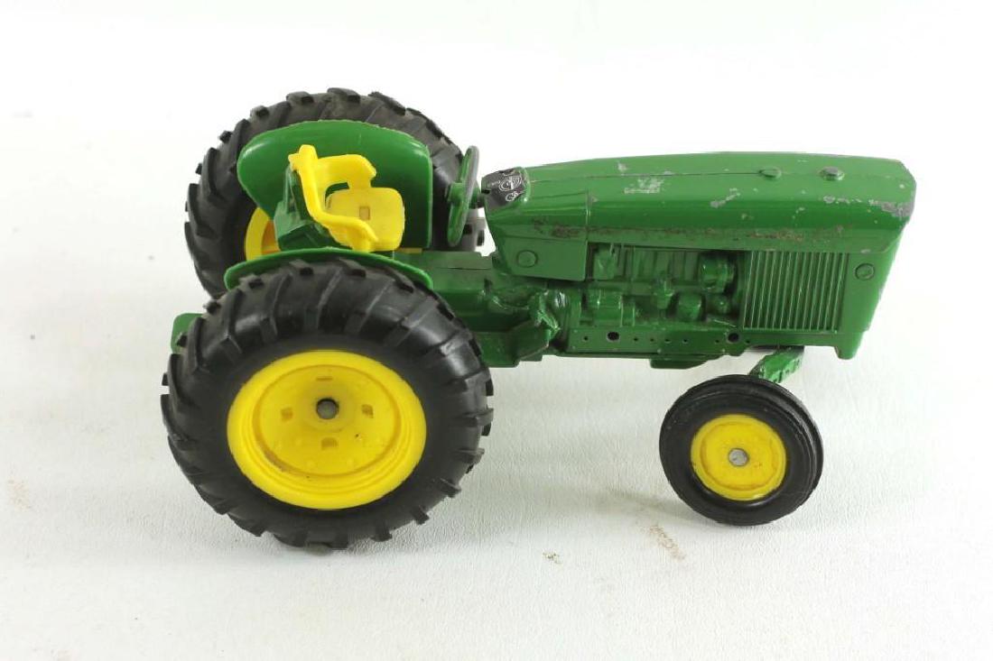 Green and Yellow Die Cast Tractor Collectible Toy: Green and Yellow Die Cast Tractor Collectible Toy Condition: some wear and chips to the paint. No exhaust pipe.