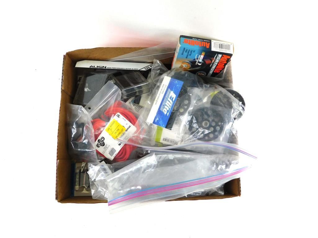 Large lot of Drone parts: Large lot of Drone parts. Not positive on this, but it looks like parts for drones. Also includes box of spark plugs E-flite parts - lots of them. Rotor blades, etc.