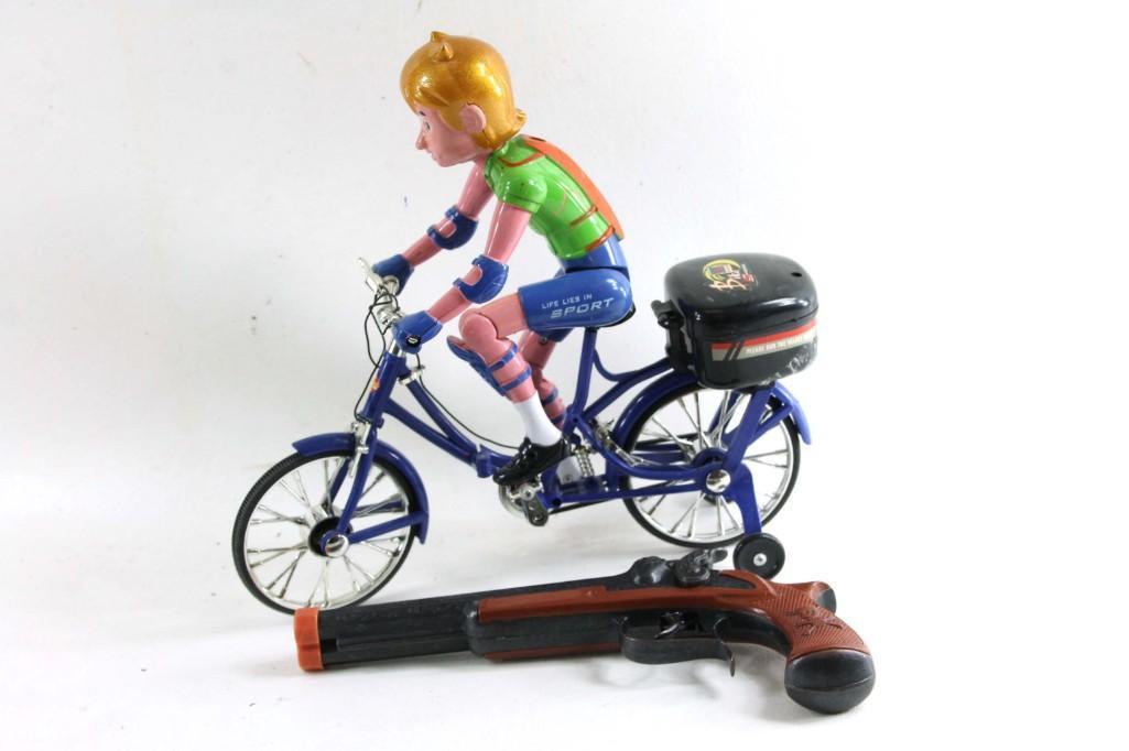 Life Lies Sport Boy on a Bicycle and a Toy Gun: Life Lies Sport Boy on a Bicycle and a Toy Gun