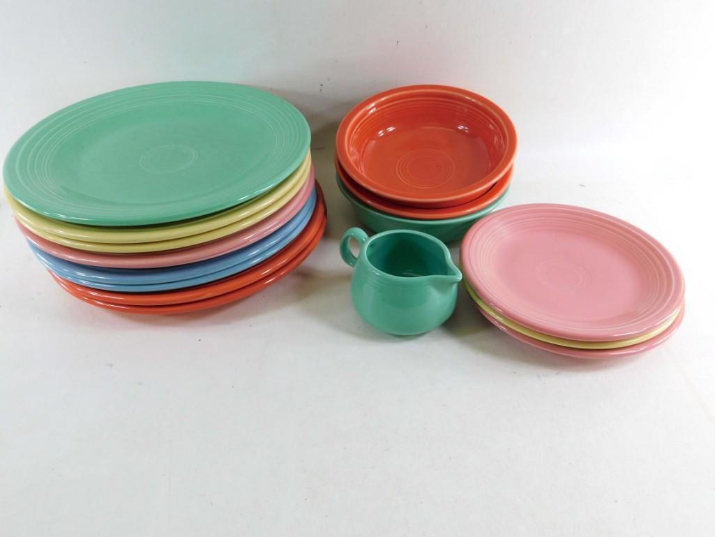 Lot of Fiestaware: Lot of Fiestaware Includes approximately 9 plates, 3 small plates, 3 bowls and one creamer