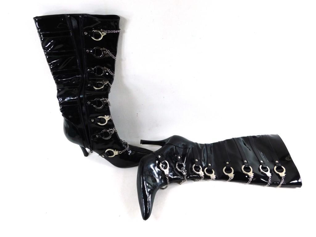 Women's Tall Boots with Mini Handcuffs Funtasma: Women's Tall Boots with Mini Handcuffs Funtasma These are very small and narrow. Can't see a size, but we are estimating a size 5 narrow. We will not guarantee that though.