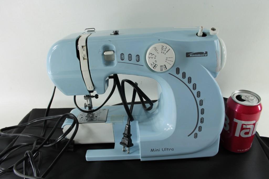 Kenmore Mini Ultra Powered Blue Sewing Machine: Kenmore Mini Ultra Powered Blue Sewing Machine with carrying bag.