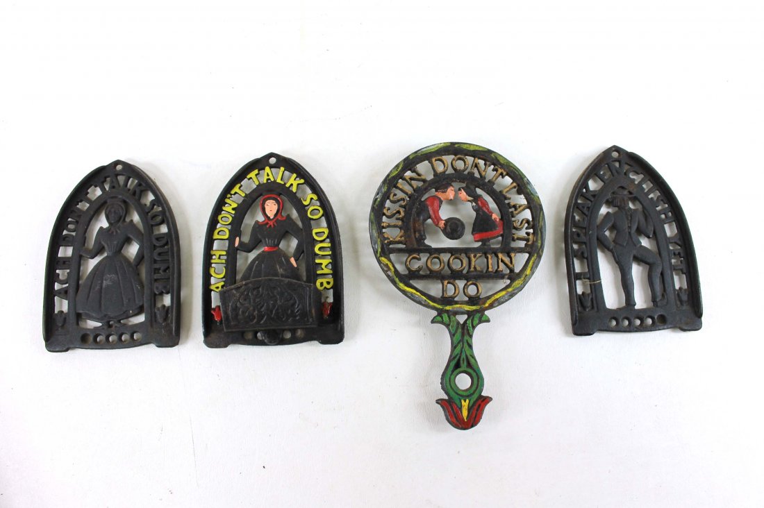 Lot of 4 Cast Iron Trivets: Lot of 4 Cast Iron Wall Hangings Includes "Ach Don't Talk so Dumb" "Kissin Dont last cookin do" "I speak Enclish yet", etc.