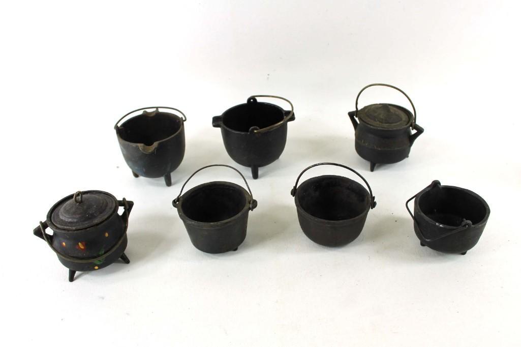 Lot of 7 vintage mini cast iron English Kettles: Lot of 7 vintage mini cast iron kettles One of them looks like it's painted