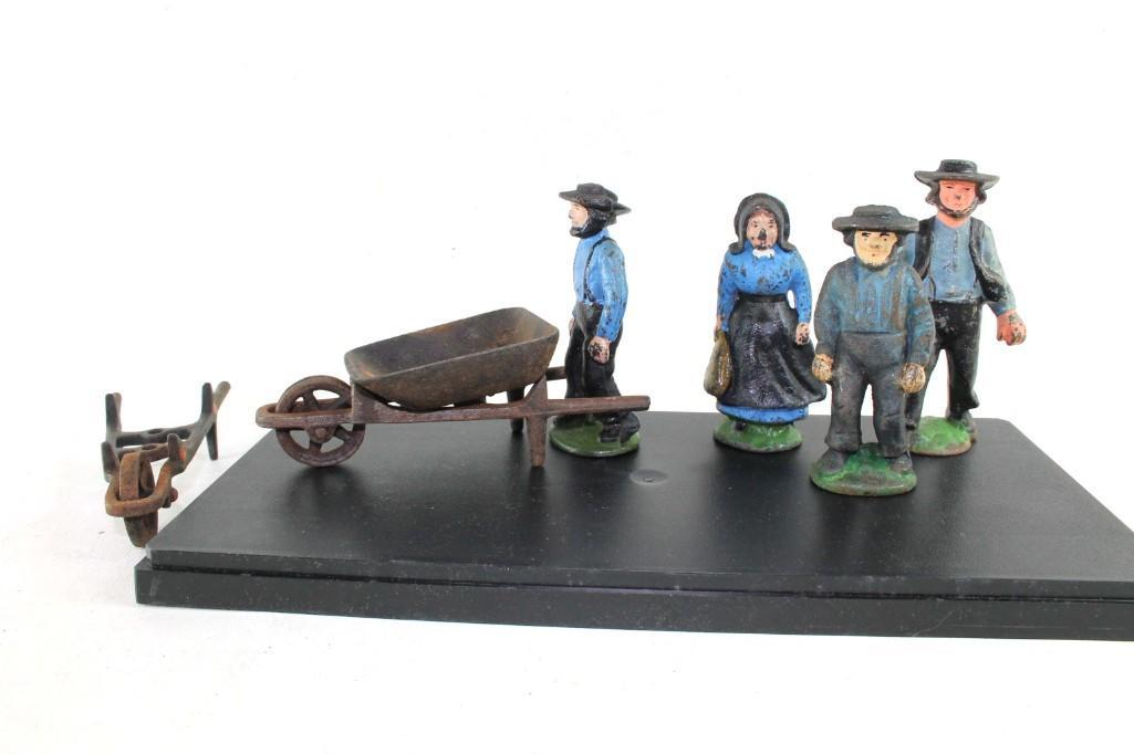 Antique Cast Iron Amish / Mennonite Set: Antique Cast Iron Amish / Mennonite Set 4 Figurines, and farm equipment