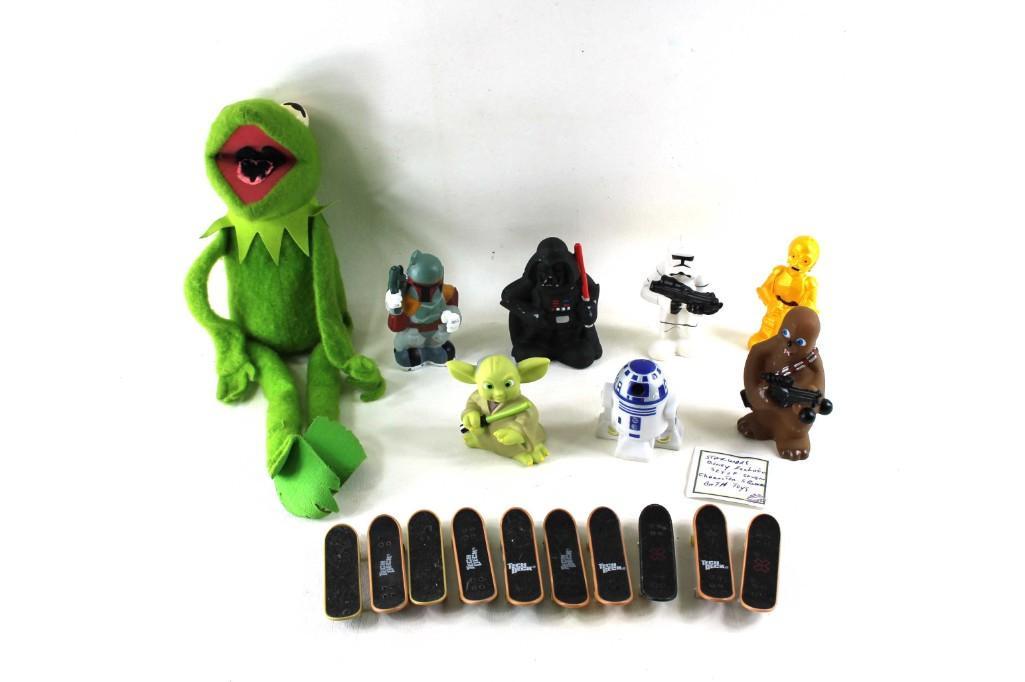 Set of 7 Star Wars Disney Exclusive Squeeze Toys, a Set: Toy lot including Set of 7 Star Wars Disney Exclusive Squeeze Toys, a Set of Mini Skateboards (many are Tech Deck) and a Kermit the Frog puppet Condition: The inside of Kermit's mouth has b