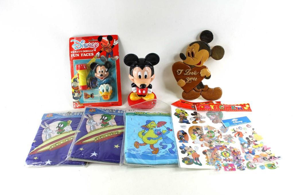 Lot of Disney , Looney Tunes , and Sesame Street Items: Lot of Disney , Looney Tunes , and Sesame Street Items including 2 Looney Tunes Child's Ponchos with Hood, Disney stickers , Mickey Mouse items, and Sesame Street child's hooded poncho