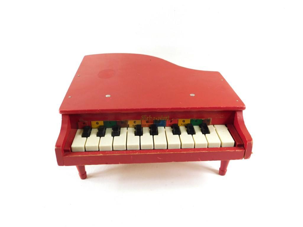 Schoenhut toy piano: Schoenhut red toy piano. Perfect for playing Mary had a Little Lamb. Condition: It doesn't sound nearly as good as your Steinway.