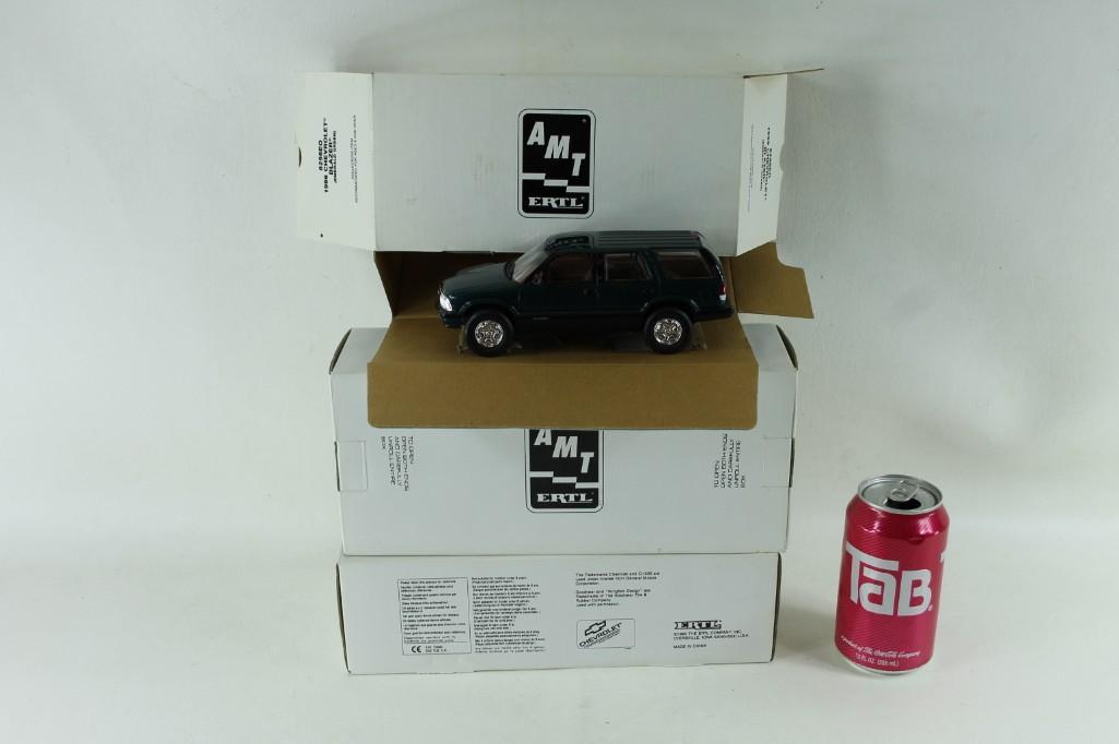 Lot of 3 Ertl Collectors Trucks: 8296EO - 1996 Chevrolet Blazer (Emerald Green) 6992EO 1995 Chevrolet C3500 (Teal Green Metallic) 6646EO 1995 Chevrolet C-1500 Pickup (Dark Garnet Red Metallic)