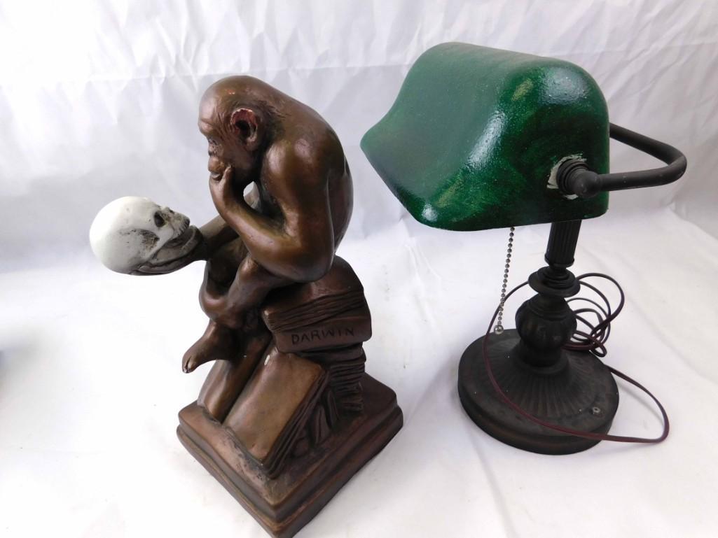 Austin Productions Darwin's Ape Thinker and a Banker's: Austin Productions Darwin's Ape Thinker and a Bankers Lamp Condition: Ape is quite chipped and the shade of the banker's lamp has been painted green