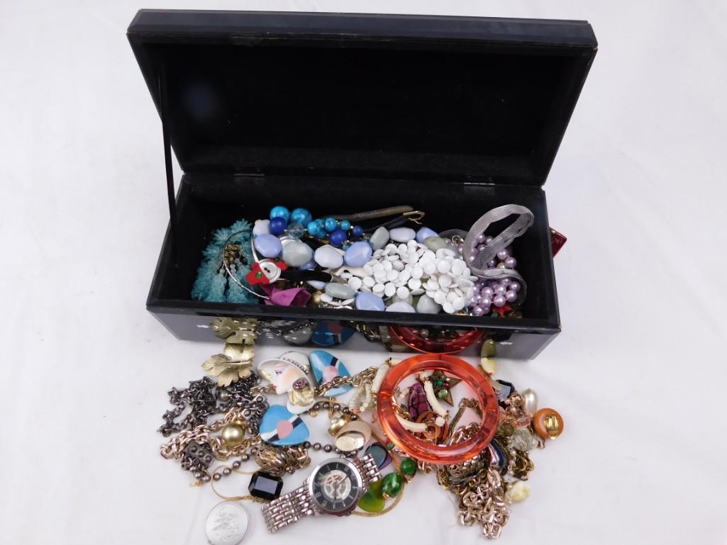 Jewelry Box Filled with Costume Jewelry and Watches: Jewelry Box Filled with Costume Jewelry and Watches Condition: Jewelry box is taped together