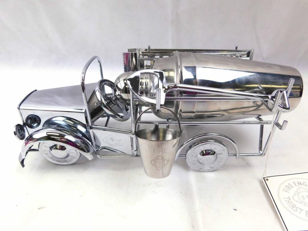 Fire Engine Bar Tools Set incl Shaker , Ice Tongs ,: Fire truck bar tool set includes the shaker, bottle opener, ice tongs, etc . Still has original tag that says " Fire Engine Thirst Extinguisher "