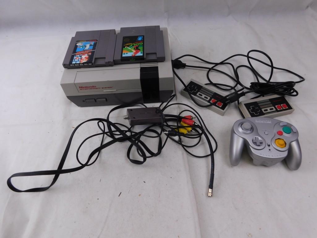 Original NES with RF and AV cords + Super Mario/Duck: Original NES with RF and AV cords + Super Mario/Duck Hunt and NES Golf Includes two regular gamepads plus a Game Cube controller for some reason. Missing power cord, but it's a standard AC cord. 
