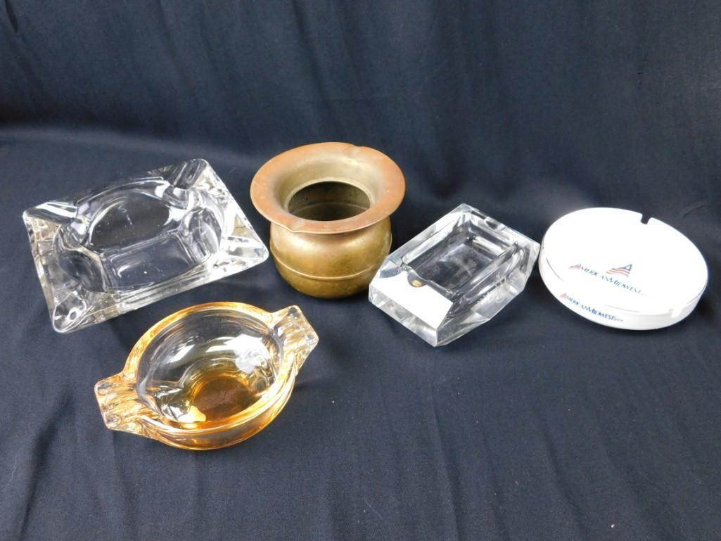Set of 5 vintage ashtrays including an advertising one: Set of 5 vintage ashtrays including an advertising one Two clear glass, one yellow/orange/clear glass, one that looks like a mini spittoon and an American Midwest Bank one.