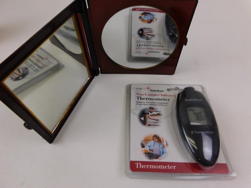 Infrared Thermometer and a folding mirror: Infrared Thermometer and a folding mirror One mirror is flat, the other is concave