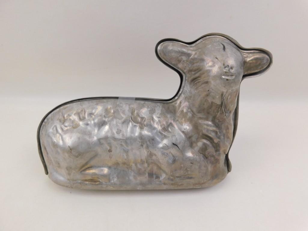 Metal Lamb Butter or Cake Mold: Metal Lamb Butter or Cake Mold This is the larger size mold, much bigger than a stick or two of butter. Butter and cake tastes better when it's molded into the shape of a lamb.