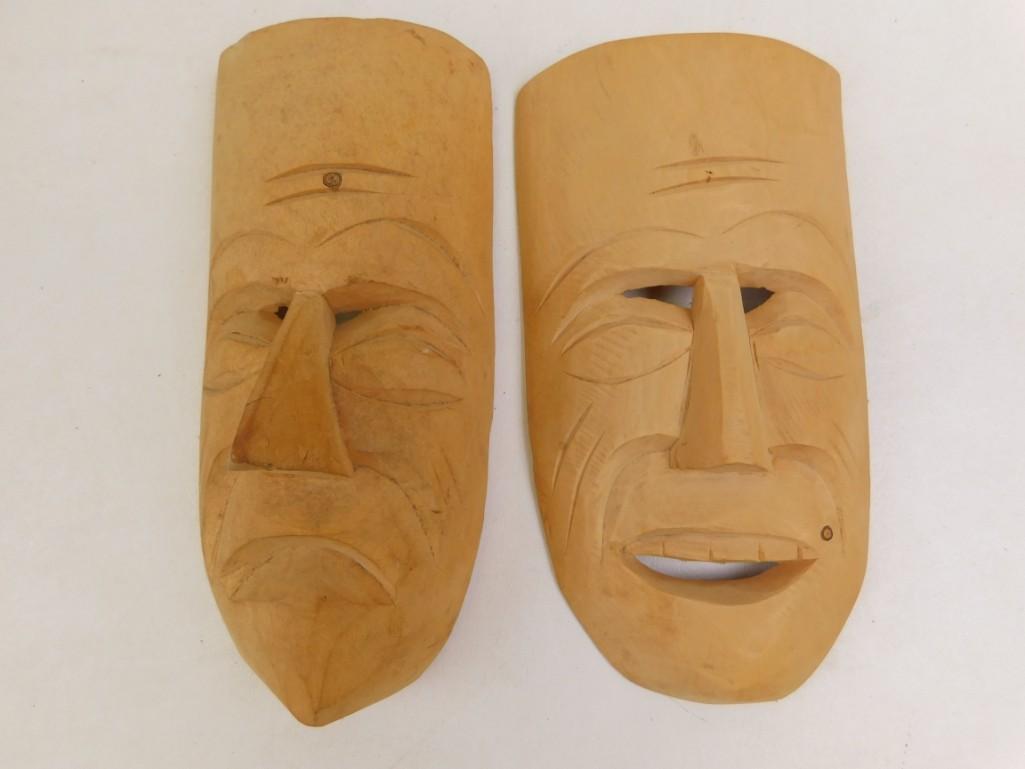 Pair of carved Wooden Face Masks: Pair of carved Wooden Face Masks These are not effective against Covid-19. But they will look good hanging on your wall