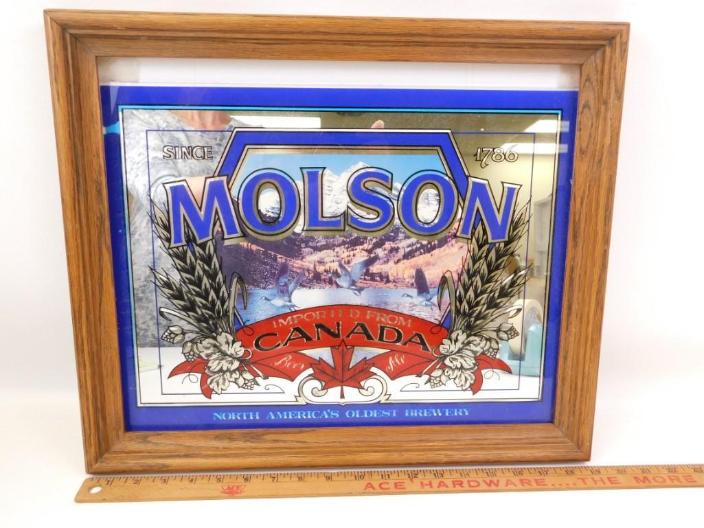 Framed Molson Beer Advertising Mirror: Framed Molson Beer Advertising Mirror . The back has a photograph of an antique store as you can see in the last picture