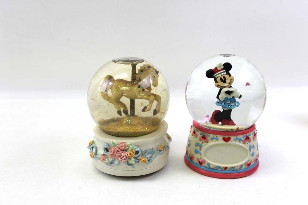 Lot of 2 Snow Globes incl Minnie Mouse and a Musical: Lot of 2 Snow Globes incl Minnie Mouse and a Musical Carousel Horse . The horse one plays music from Cats "Memories"