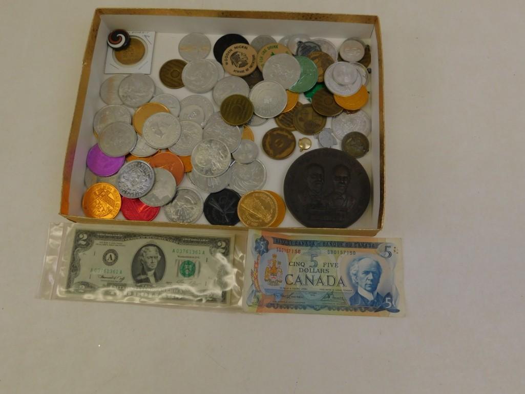 Lot of Misc. Tokens plus a $2 bill and Canadian $5: Lot of Misc. Tokens plus a $2 bill and Canadian $5 Comes with a $2 instant rebate. And if you go to Canada with it, you can get a $5 rebate 
