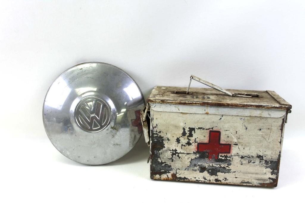 Vintage VW Volkswagen Hubcap and a Military Ammo Can: Vintage VW Volkswagen Hubcap and a Vintage Military Ammo Can that has been turned into a First Aid Kit. It's empty, however