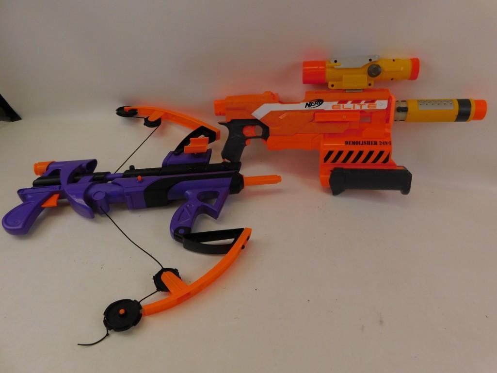 Lot of 2 Nerf and Nerf Type Dart Guns: Lot of 2 Nerf and Nerf Type Dart Guns One looks like it's supposed to be a crossbow. Elite Demolisher 2-in-1 with scope