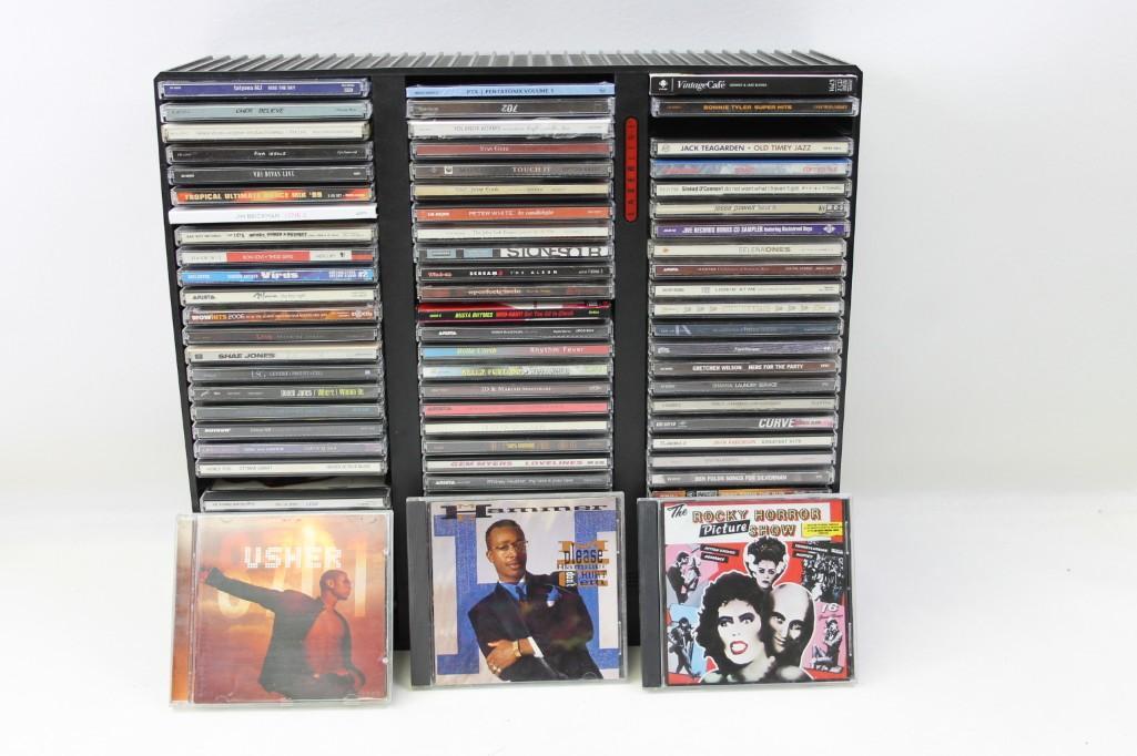 Large Lot of CD's and Holder: Large Lot of CD's and Holder Includes MC Hammer, Rocky Horror Picture Show, Ben Folds, Whiteny Houston, Nelly Furtado, Busta Rhymes, Sarah McLachlan, Duran Duran, Sinead O'Connor, Bonnie Tyler, Tracy 